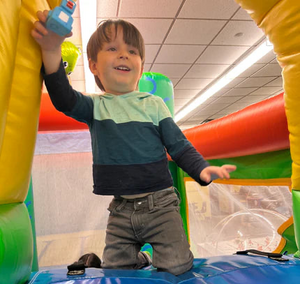 Kids zone featuring free activities like bounce houses, games, coloring, workshops, activities, and more at the Blood and Ink Tattoo & Horror Con at the Westchester County Center in White Plains New York